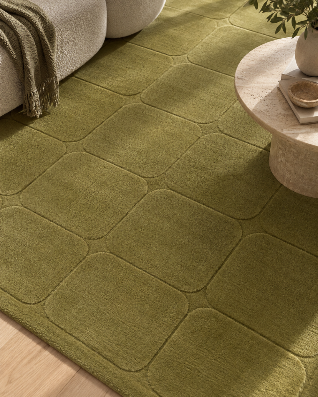 Momeni Contour CON-6 Green Style Shot — Green textured geometric rug close-up in a modern interior.