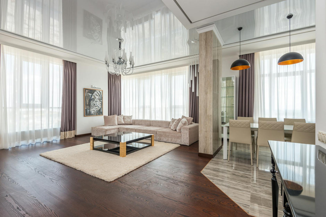 Spacious and elegant contemporary living room with modern furniture and neutral tones.