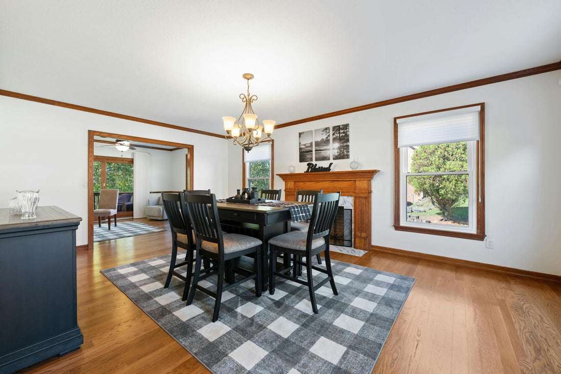 Elegant dining room featuring dark furniture and abundant natural light.