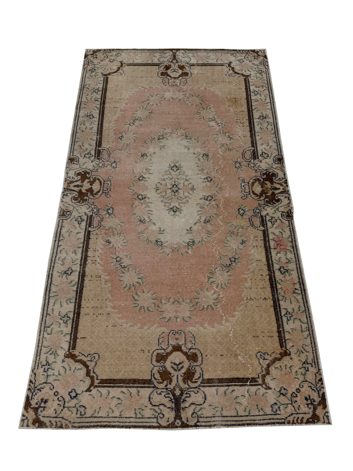Close-up detail of the hand-knotted wool texture on the Artisan Angelina Lt. Gold rug