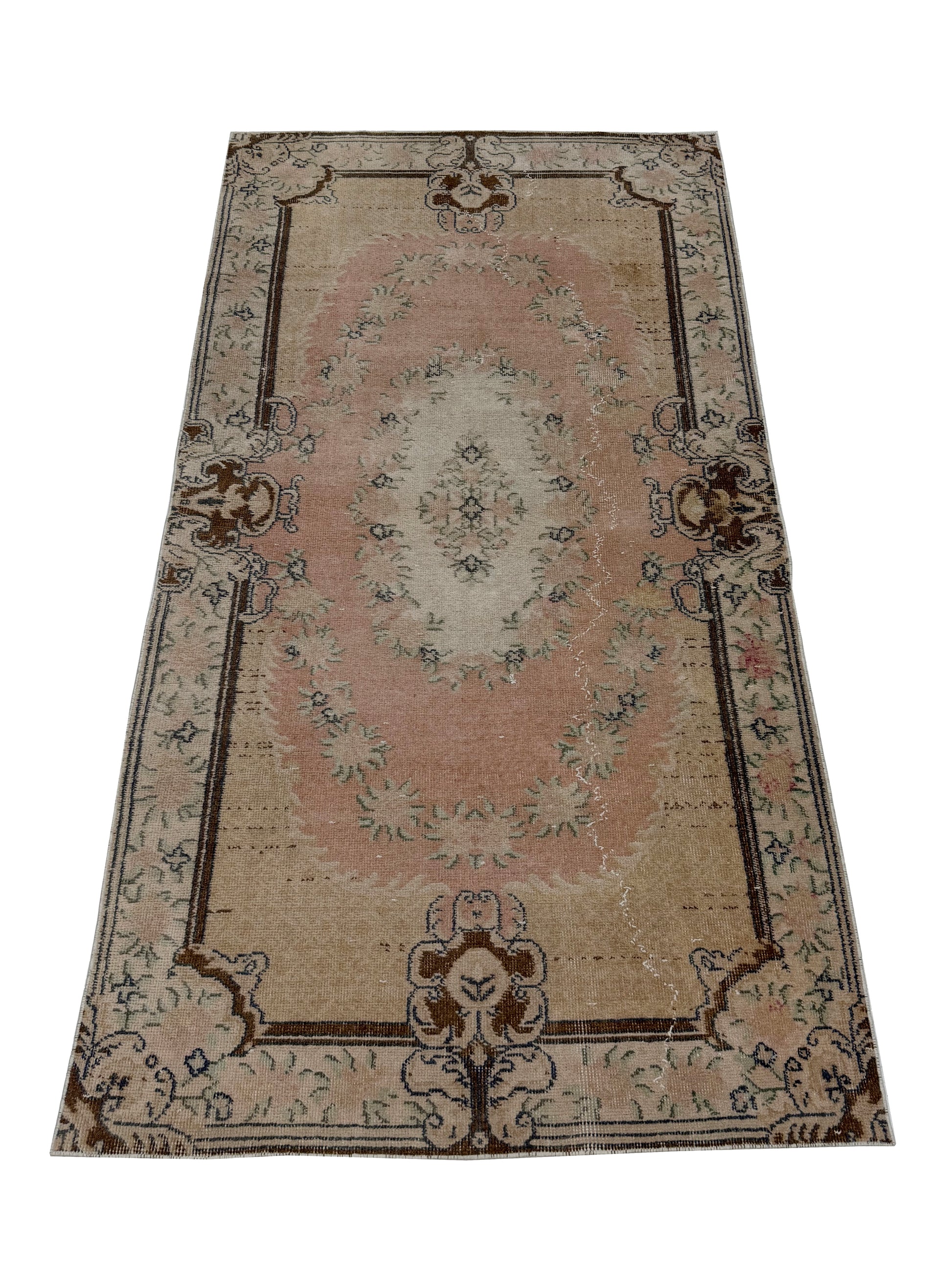 Close-up detail of the hand-knotted wool texture on the Artisan Angelina Lt. Gold rug