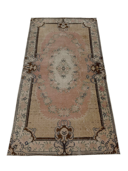 Close-up detail of the hand-knotted wool texture on the Artisan Angelina Lt. Gold rug