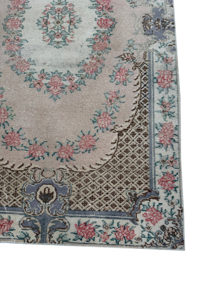 Artisan Angelina Coral rug showing the unique distressed vintage patina and coral hues