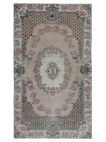 Artisan Angelina Coral Vintage Knotted Rug overhead view showing geometric Anatolian patterns