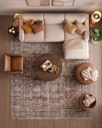 Amber Lewis x Loloi Georgie GER-06 Bordeaux Antique Living Room Overhead Shot — Overhead view of a bordeaux antique area rug in a living room.