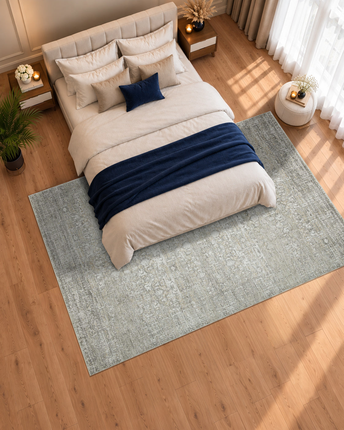Amber Lewis x Loloi Honora HON-04 Grey Beige Bedroom Overhead Shot — Overhead view of a grey and beige rug beneath a cream bed with navy accents.
