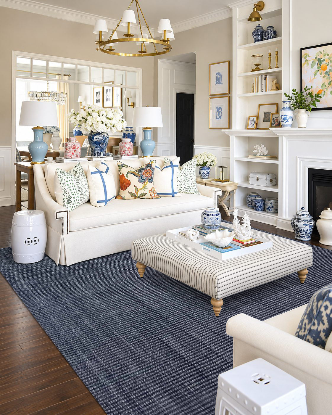 Artisan Carey Navy Living Room Shot — Textured navy area rug in a bright living room with blue and white accents.