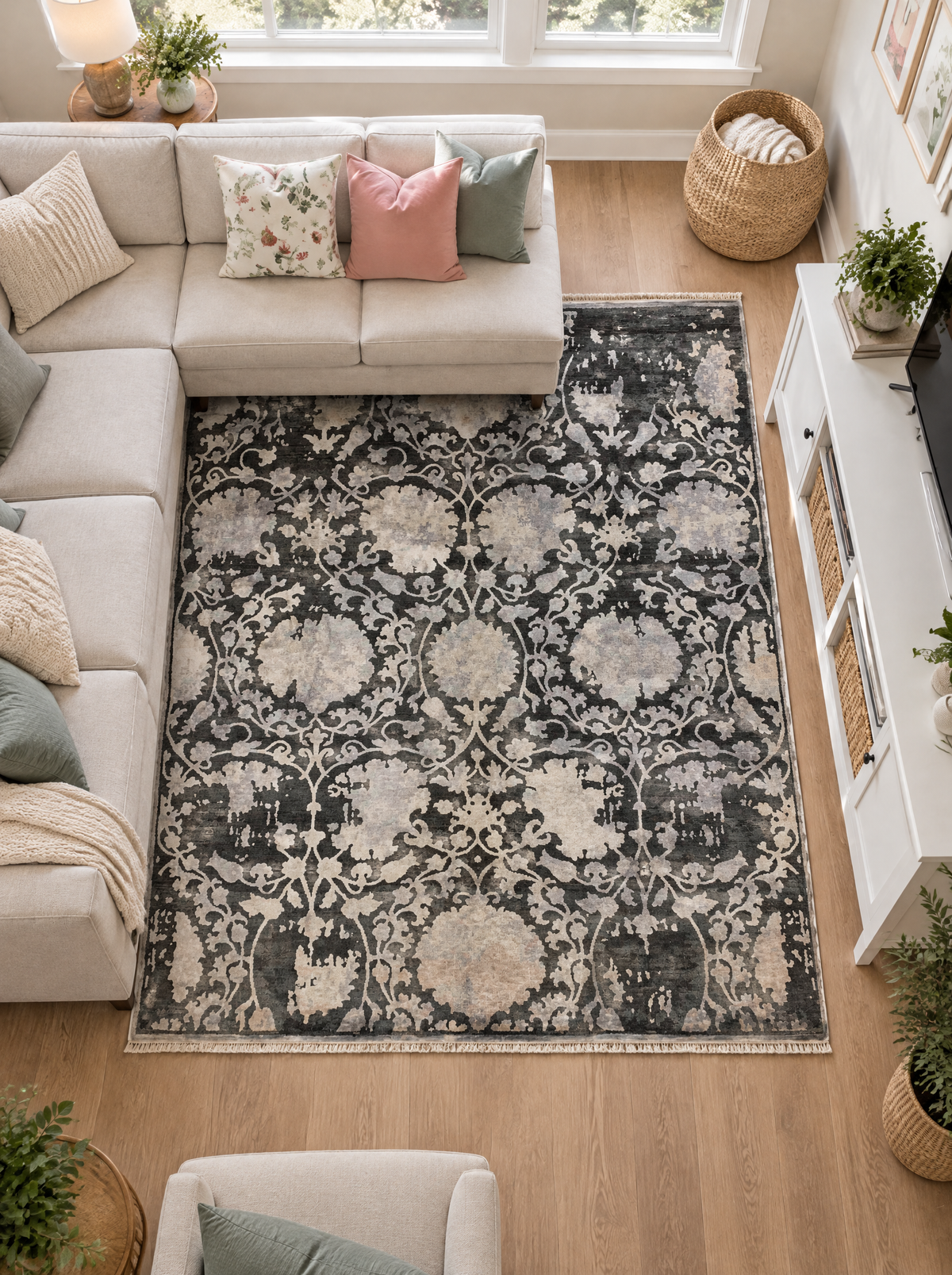 Artisan Emma Slate Living Room Overhead Shot — Overhead view of a slate floral rug framed by cream sofas.