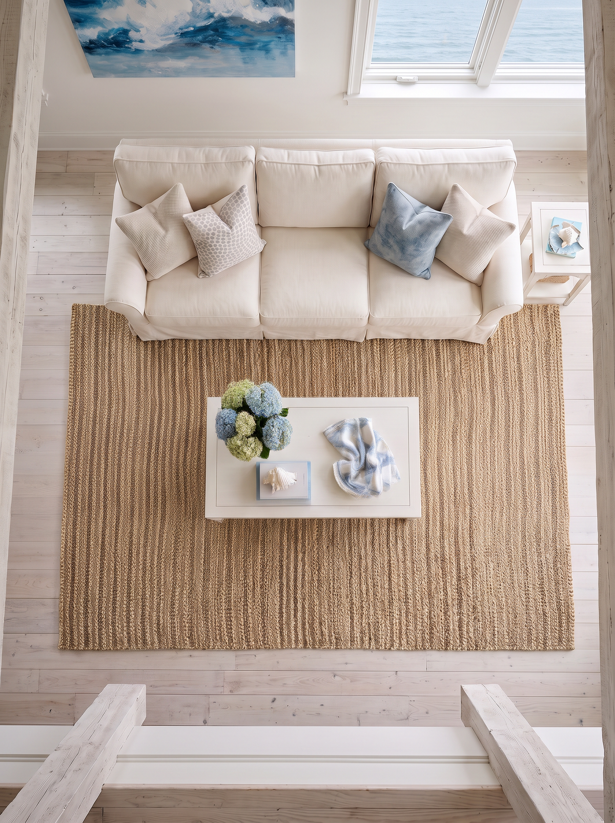 Artisan Natural Weave KM103 Natural Living Room Overhead Shot — Overhead view of a ribbed natural rug anchoring a bright living room.