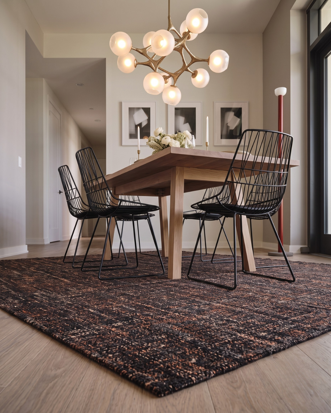 Dalyn Rugs Abruzzo AZ1 Black Dining Room Corner Shot — Textured black area rug in a modern dining room.