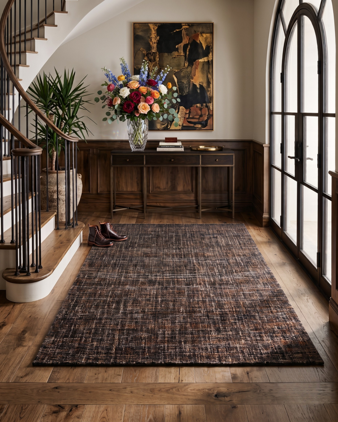Dalyn Rugs Abruzzo AZ1 Black Style Shot — Textured black area rug in a stylish entryway.
