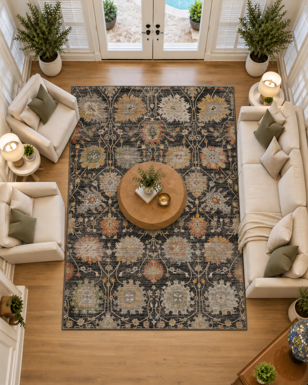 Dalyn Rugs Aristo AR6 Black Living Room Overhead Shot — Black multicolor floral area rug shown from above in a bright living room.