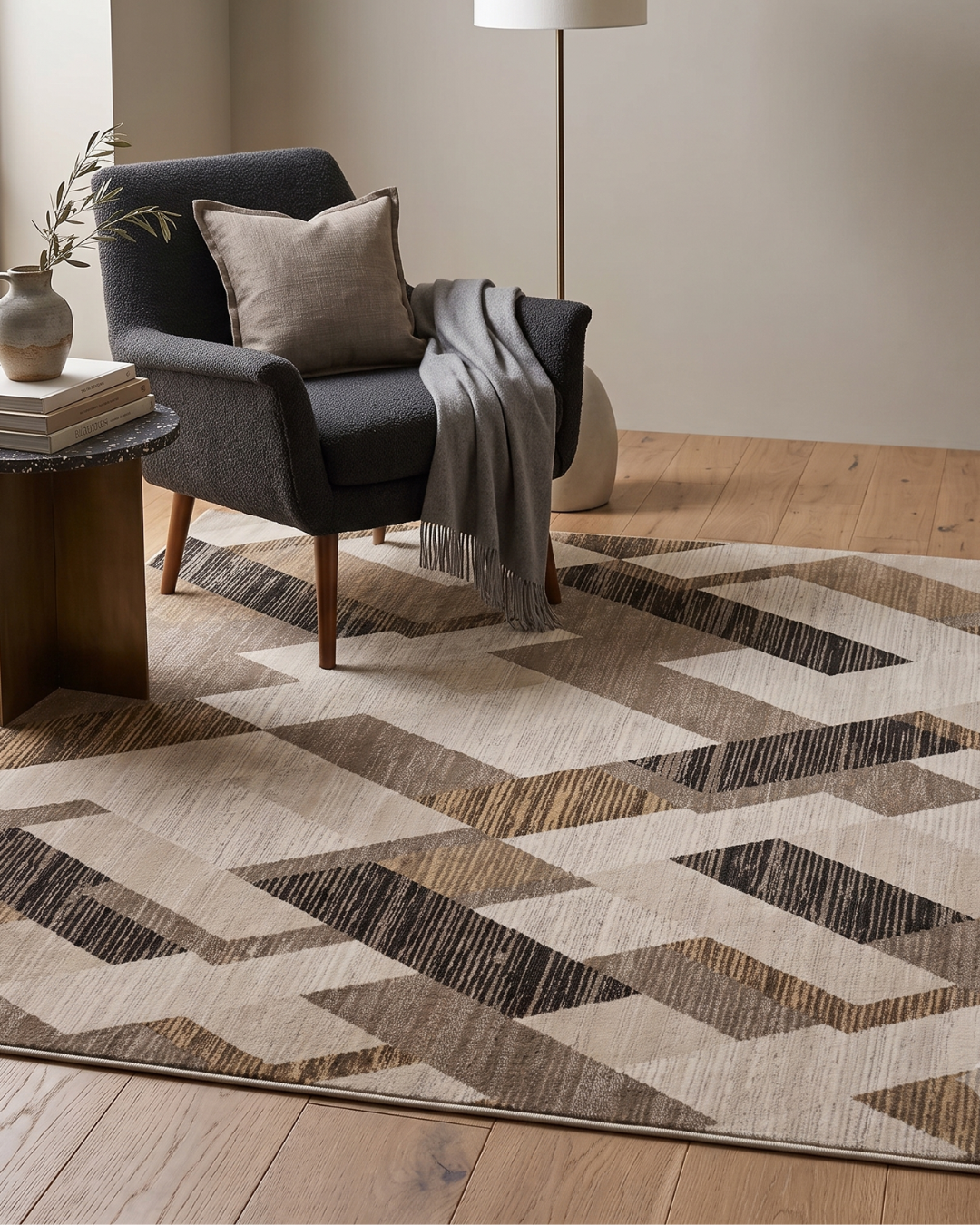 Dalyn Rugs Denizi DZ5 Putty Style Shot — Putty geometric area rug styled with a modern accent chair.