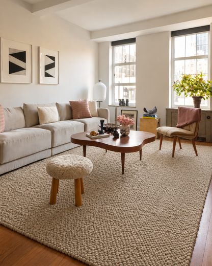 Dalyn Rugs Gorbea GR1 Latte Living Room — Neutral textured latte rug styled in a contemporary living room.