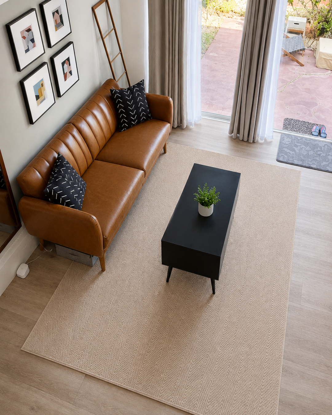 Dalyn Rugs Monaco Sisal MC200 Linen Living Room Overhead Shot — Linen herringbone area rug in a modern living room overhead view.