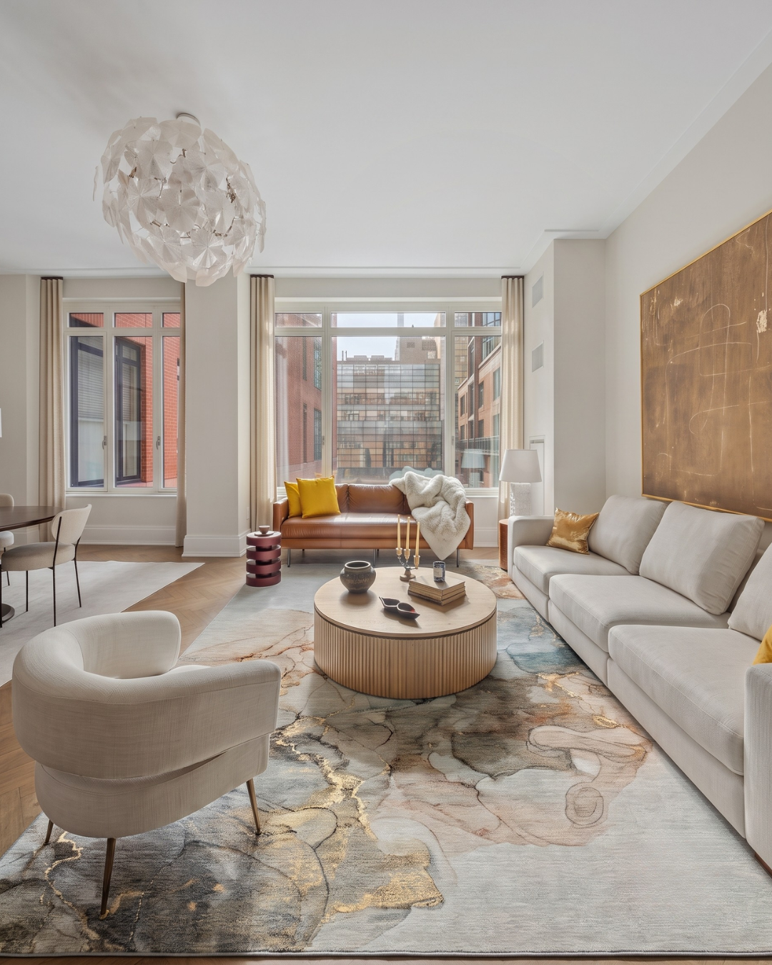 Dalyn Rugs Odyssey OY12 Tan Living Room Shot — Tan area rug in a bright modern living room.