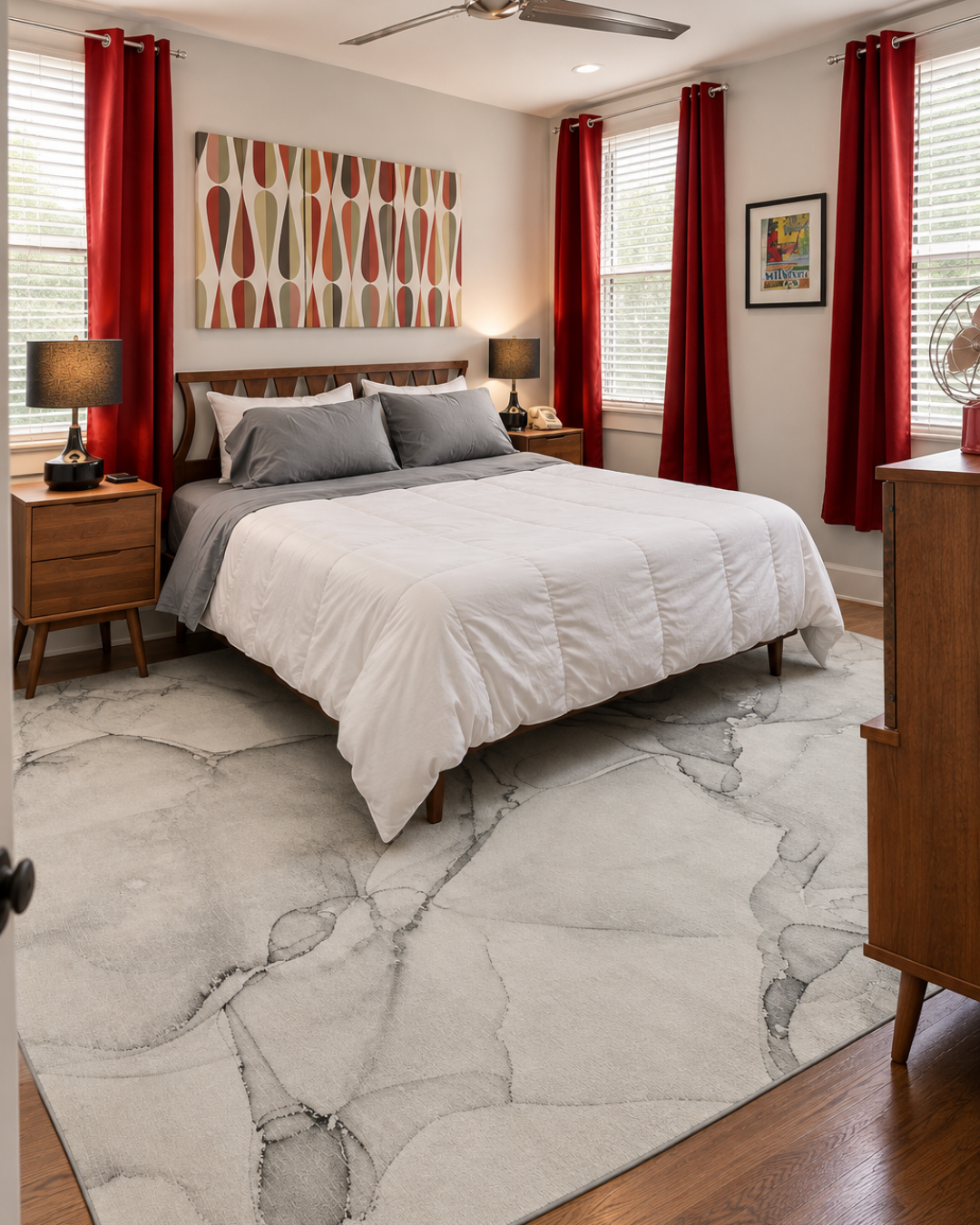 Dalyn Rugs Odyssey OY13 Gray Bedroom — Gray abstract area rug in a modern bedroom with red accents.