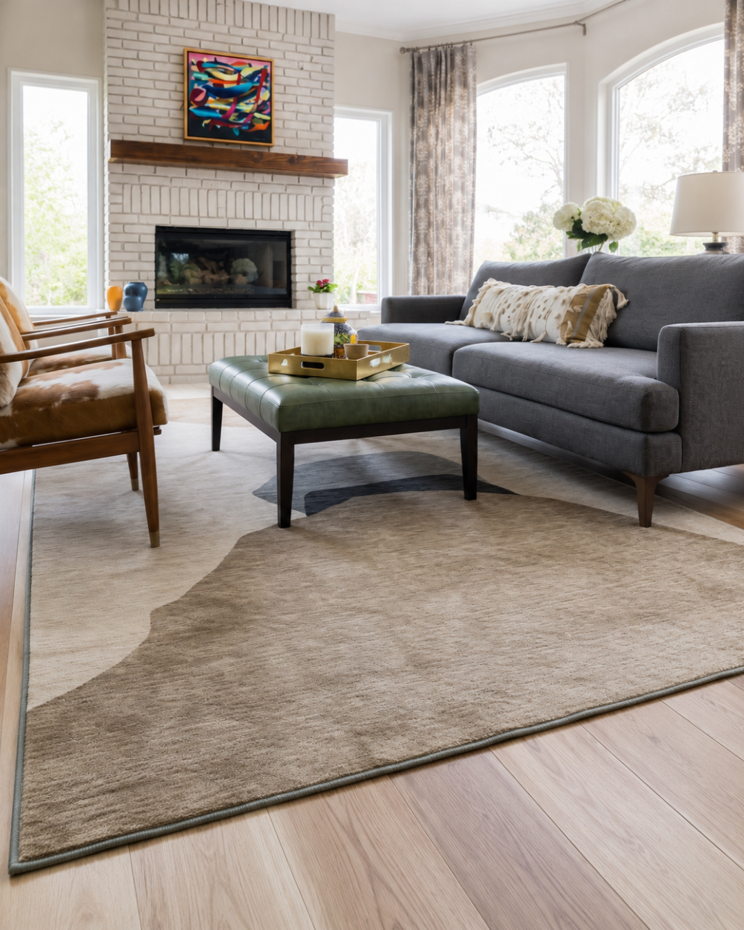 Dalyn Rugs Odyssey OY17 Taupe Corner Shot — Taupe abstract area rug styled in a bright living room.