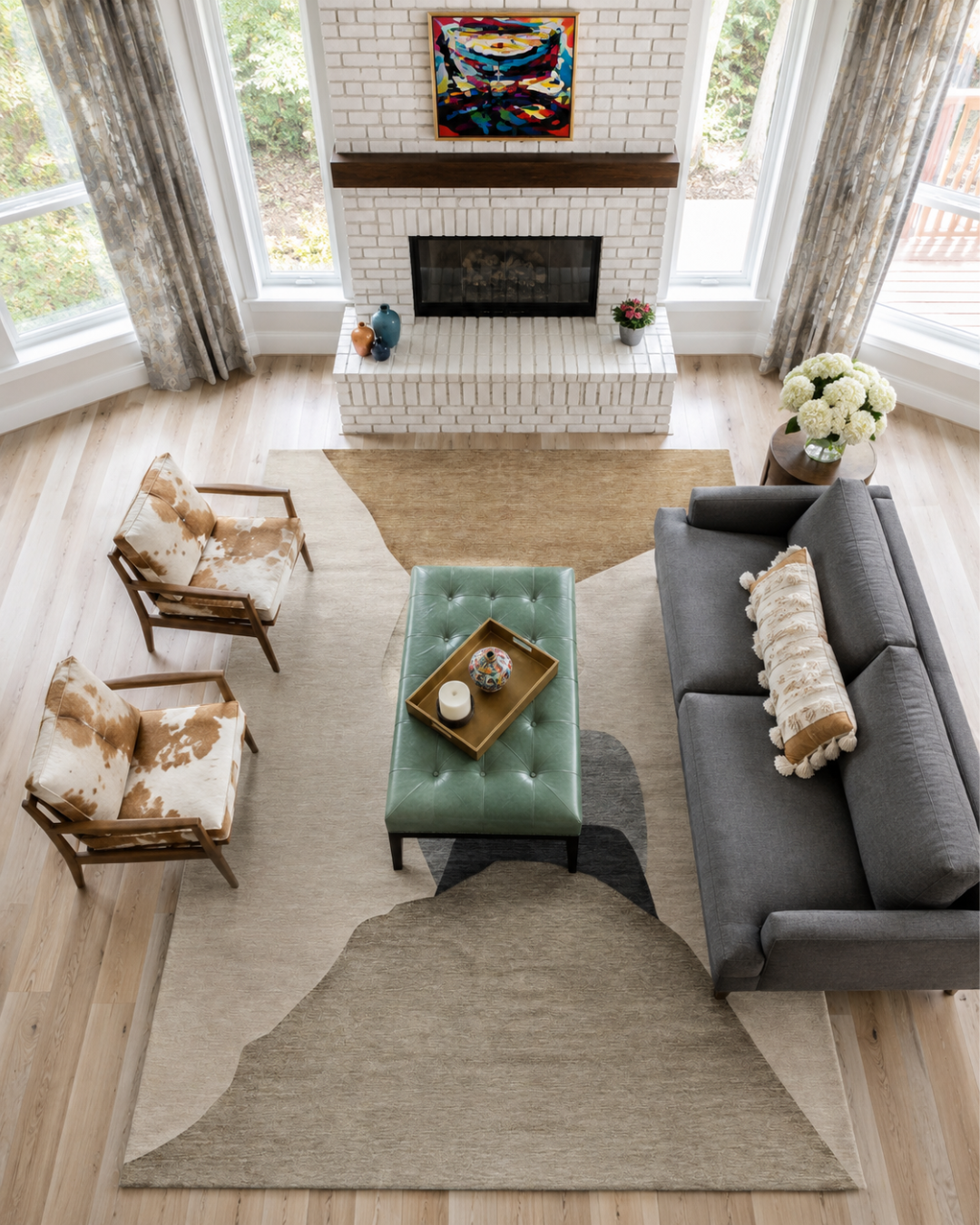 Dalyn Rugs Odyssey OY17 Taupe Overhead Shot — Overhead view of a taupe abstract rug beneath living room furniture.
