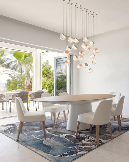 OY3 Blue Dining Room: Blue abstract rug with modern dining furniture.