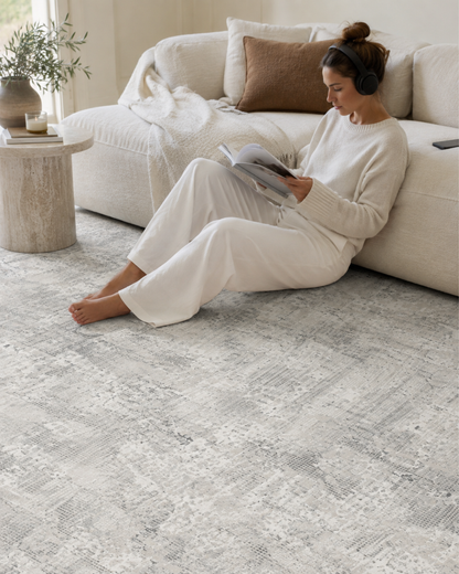Dalyn Rugs Rhodes RR3 Silver Living Room Style Shot — Silver abstract area rug with soft neutral living room styling.