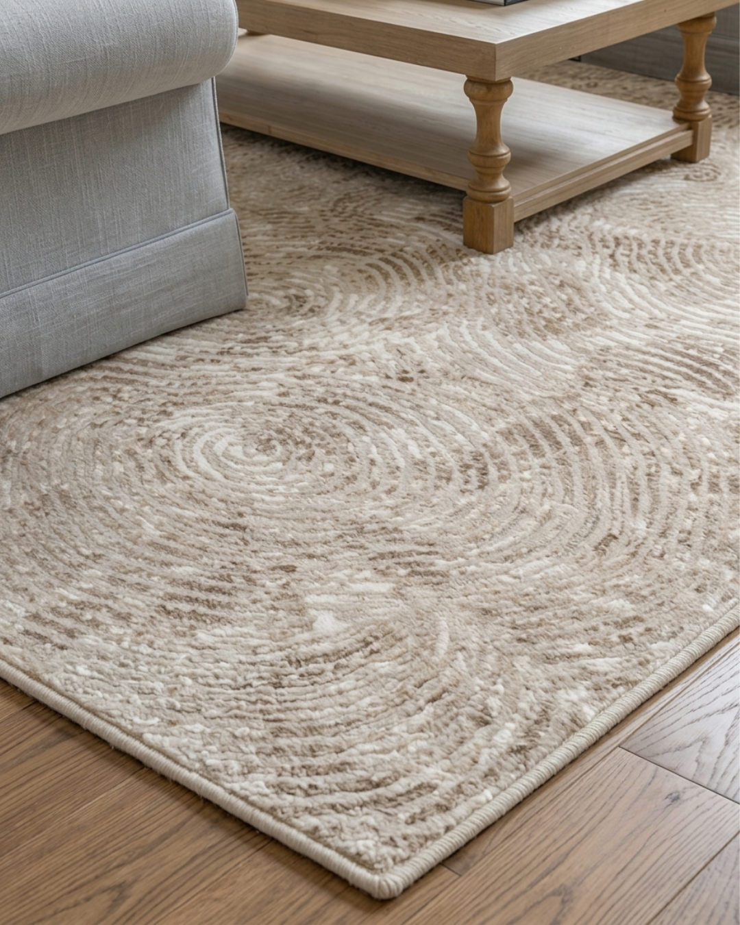 Dalyn Rugs Rhodes RR5 Taupe Corner Shot — Textured taupe swirl-pattern area rug corner detail.