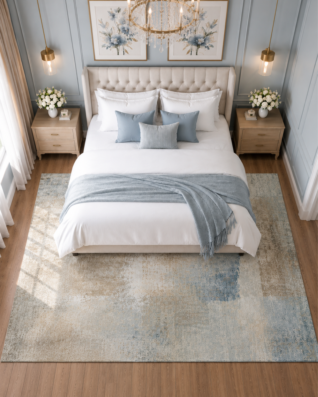 Dalyn Rugs Trevi TV5 Taupe Bedroom Overhead Shot — Taupe and soft blue distressed area rug beneath a modern bed.