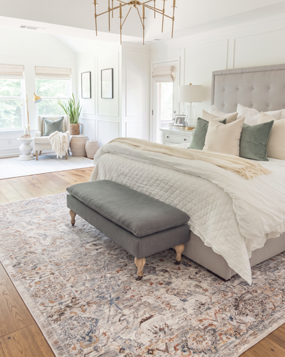 Dalyn Rugs Vienna VI3 Linen Bedroom — Linen traditional area rug with soft blue and rust accents in a bedroom.