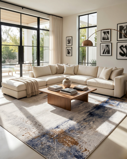 Feizy Clio 39LXF Ivory Blue – Contemporary abstract rug styled in a luxury living room with neutral furnishings.