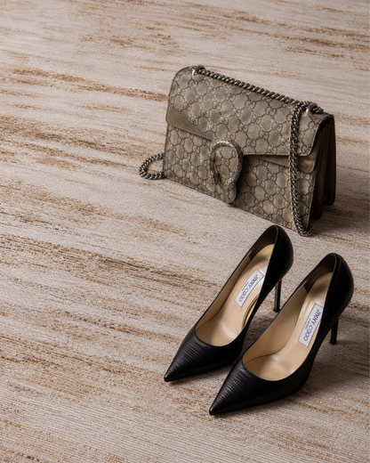 Feizy Deja Rug 39PKF dark taupe textured abstract rug styled with designer handbag and heels