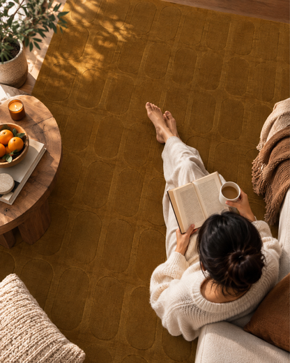 Momeni Rugs Contour CON-2 Mustard Style Shot — Mustard geometric textured area rug in a cozy lifestyle setting.