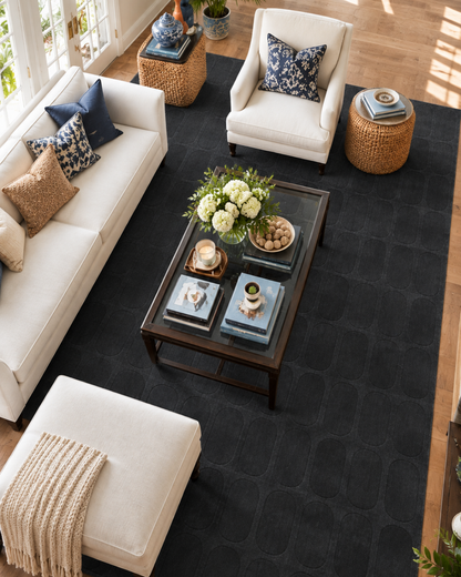 Momeni Rugs Contour CON-2 Navy Living Room Overhead Shot — Navy textured geometric area rug in a bright contemporary living room.