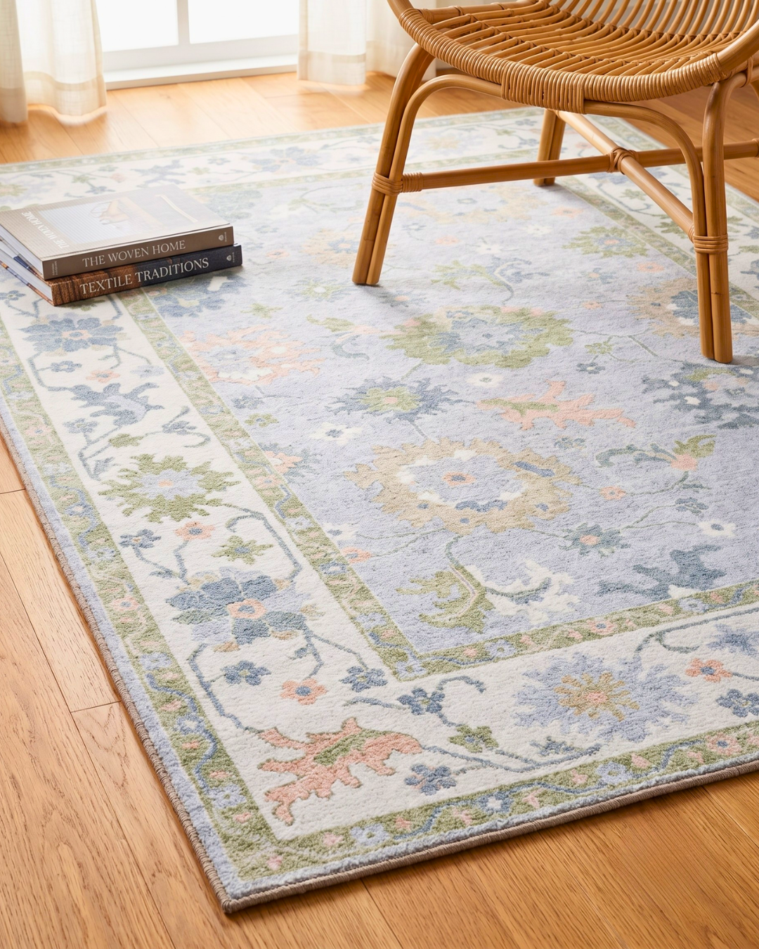 Oriental Weavers Addison ADD06 Blue Green floral rug styled with woven chair