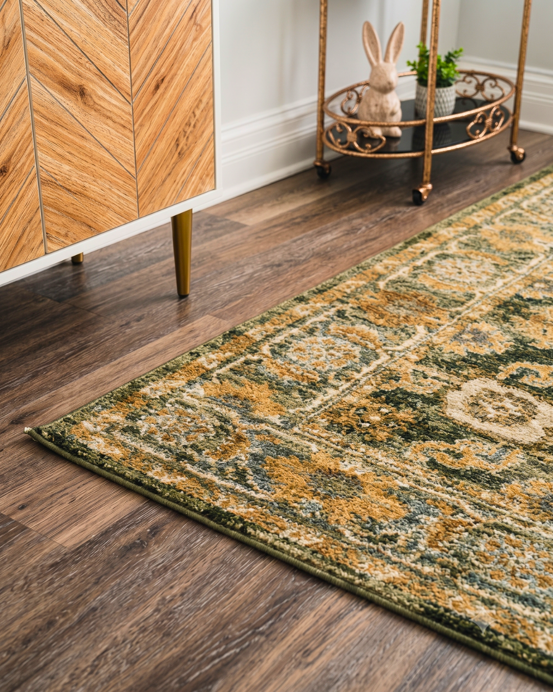 Oriental Weavers Andorra 2417B Green Gold traditional area rug close-up with olive green, gold and ivory floral border.