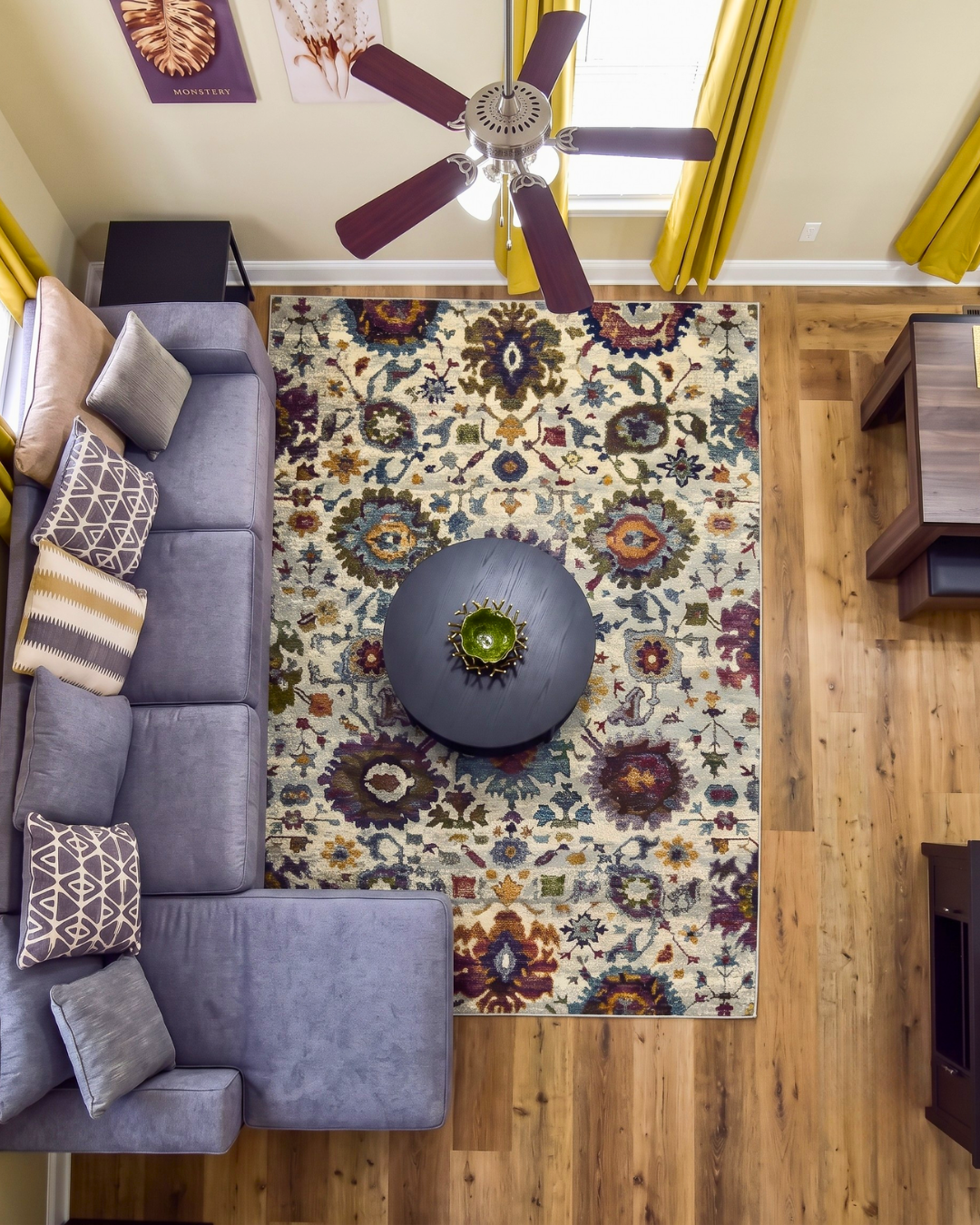 Oriental Weavers Andorra 7129A Stone Multi floral rug in a living room overhead view.