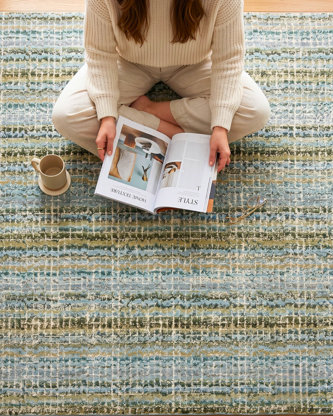 Oriental Weavers Atlas 747B0 Blue Green modern rug style shot with reader