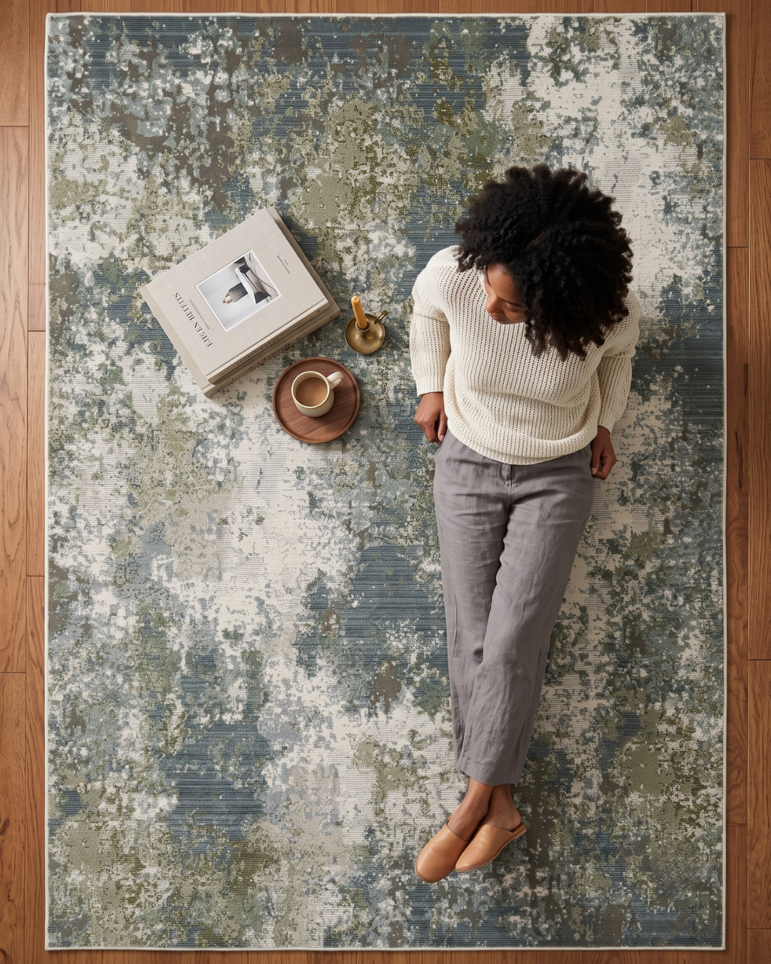Oriental Weavers Caravan 5090E Blue Green abstract rug style shot with woman