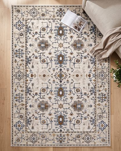Oriental Weavers Ellington ELL10 Ivory Blue floral rug styled in contemporary living space
