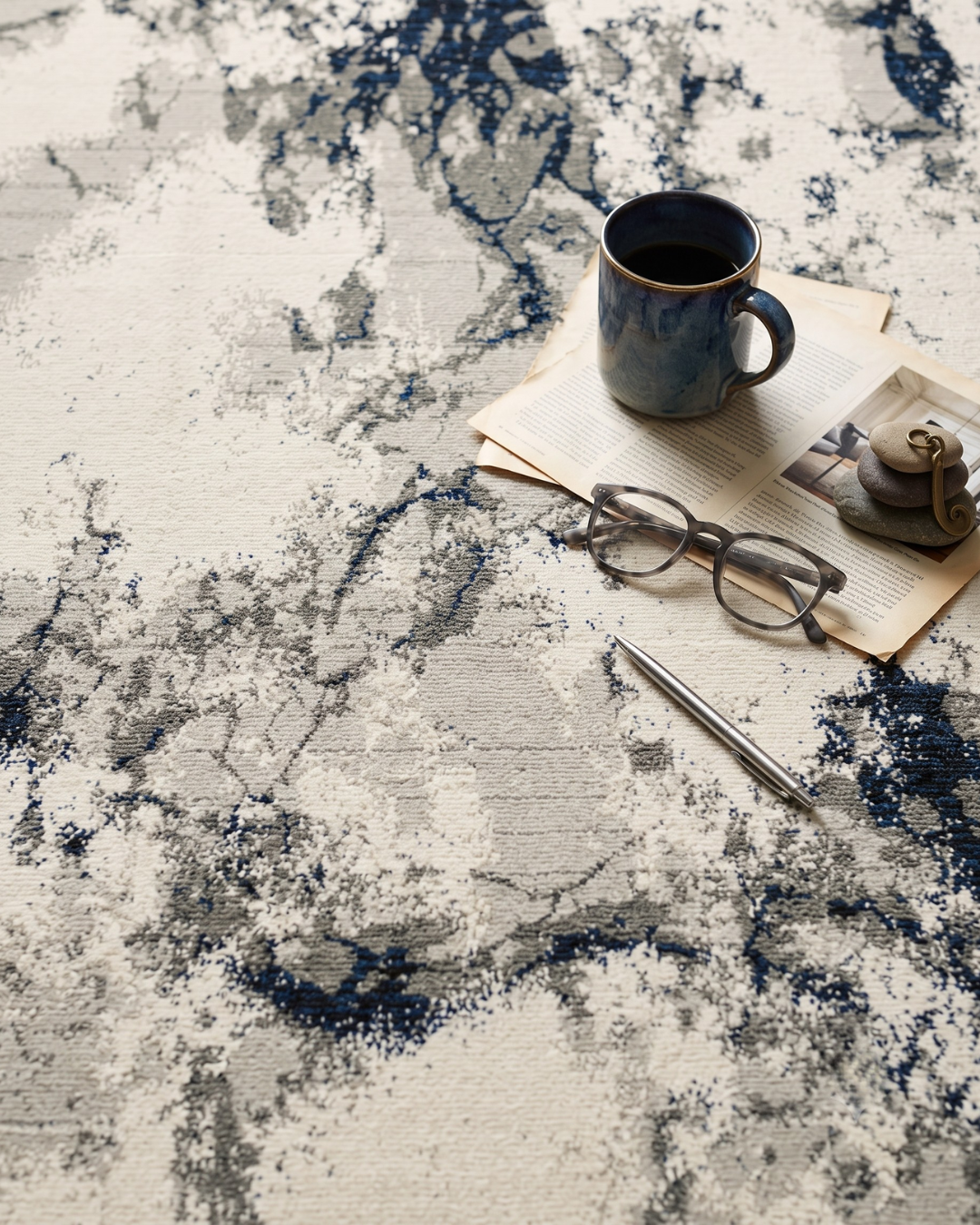 Oriental Weavers Evolution 0978A Ivory Beige abstract rug with coffee mug