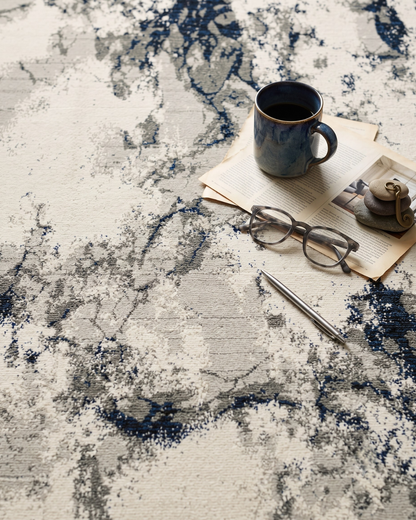 Oriental Weavers Evolution 0978A Ivory Beige abstract rug with coffee mug