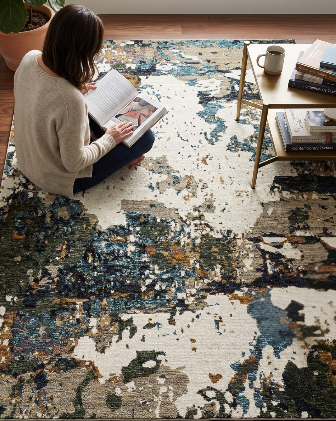 Oriental Weavers Evolution 0981A Ivory Multi abstract rug with woman reading