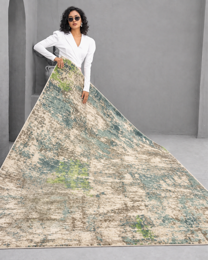 Oriental Weavers Formations 70007 Blue Green rug held by woman for size reference