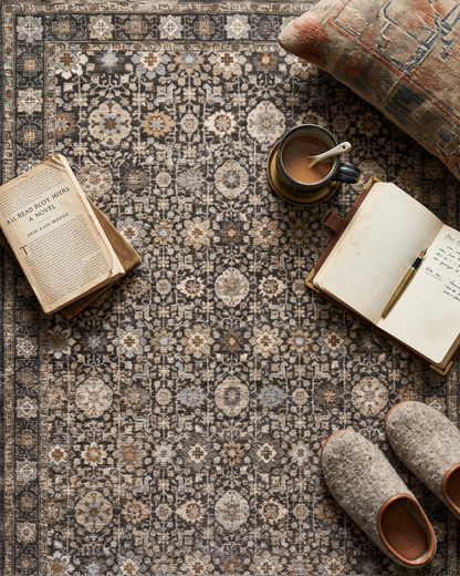 Oriental Weavers Maharaja 070N1 Grey Ivory traditional rug styled with books and coffee