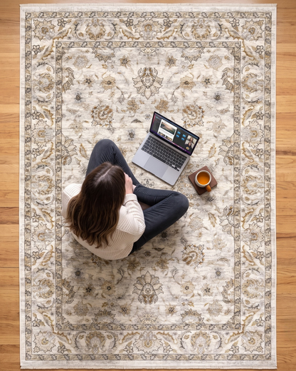Oriental Weavers Maharaja 070W1 Ivory Grey rug style shot with laptop