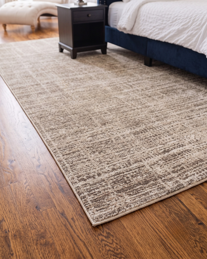 Oriental Weavers Nebulous 071E9 Beige Ivory abstract rug close-up in modern bedroom