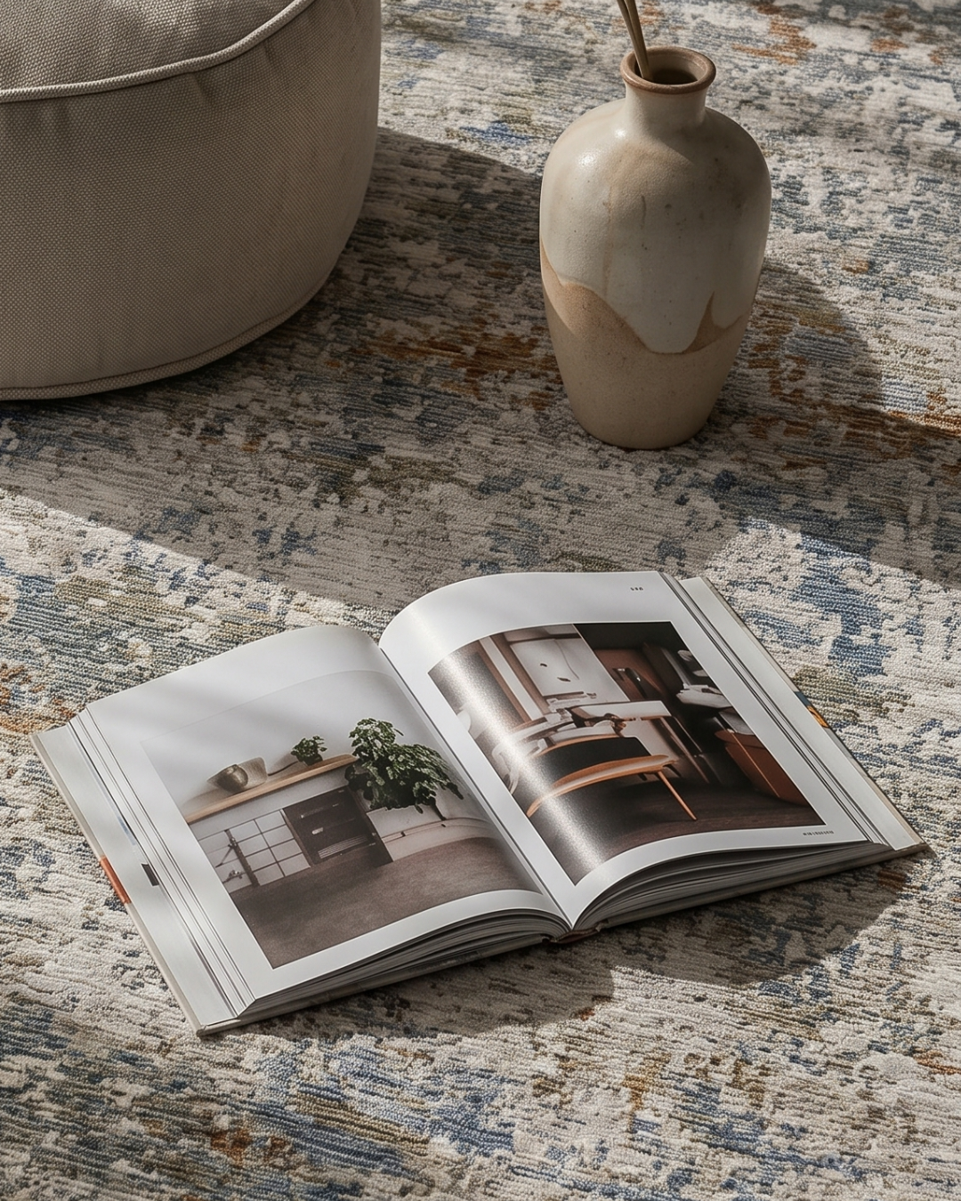 Oriental Weavers Soho SOH03 Beige Multi rug styled with book and ceramic vase