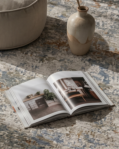 Oriental Weavers Soho SOH03 Beige Multi rug styled with book and ceramic vase