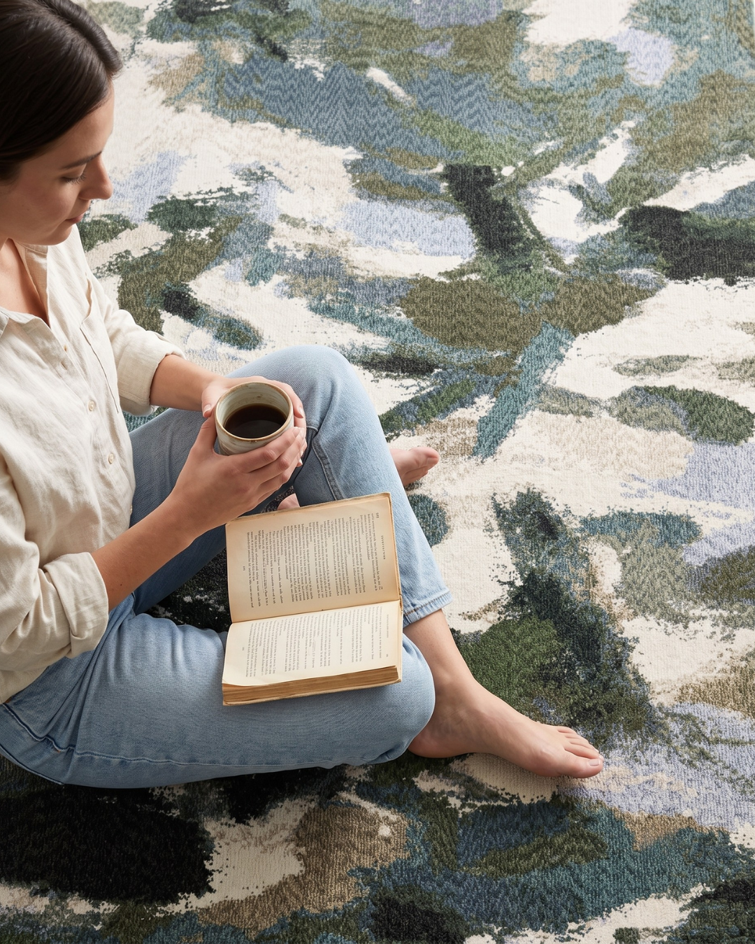 Oriental Weavers Tisdell TIS04 Blue Green abstract rug with woman reading